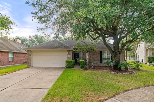 ranch-style house with an attached garage, driveway, a front lawn, and brick siding