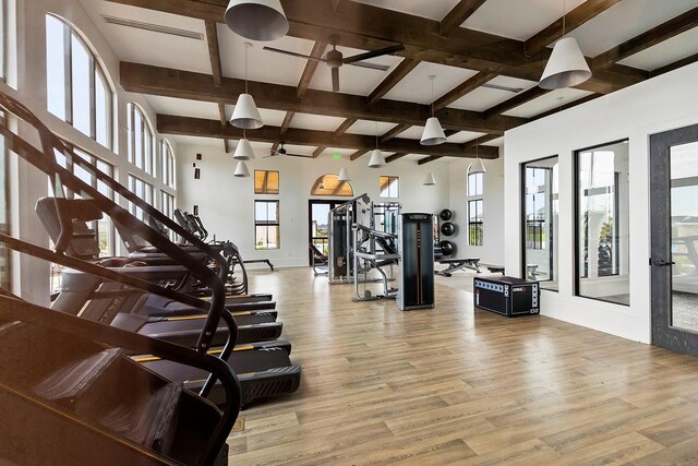 gym with wood-type flooring and ceiling fan