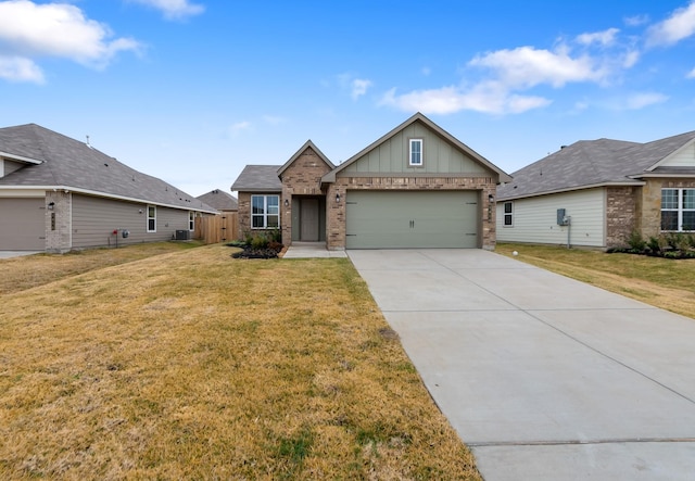 view of front of property with a garage and a front yard