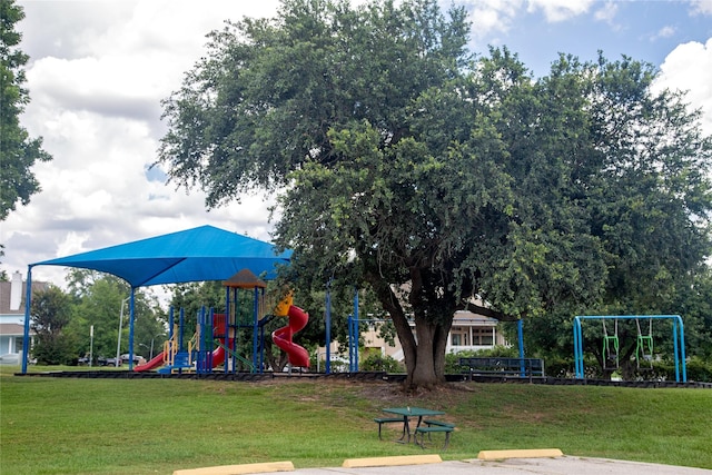 view of jungle gym featuring a lawn