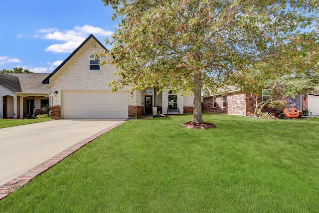 view of front of property featuring a front yard and a garage