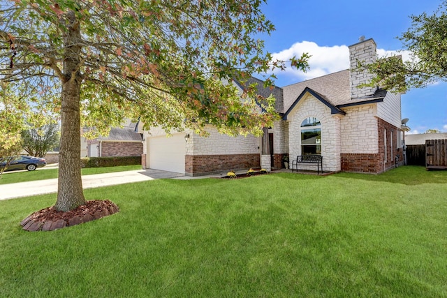 view of front of home with a front yard and a garage