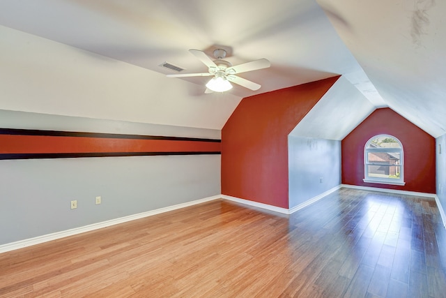 bonus room featuring vaulted ceiling, light hardwood / wood-style flooring, and ceiling fan