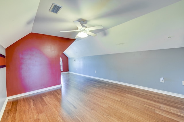 bonus room with light hardwood / wood-style flooring, vaulted ceiling, and ceiling fan