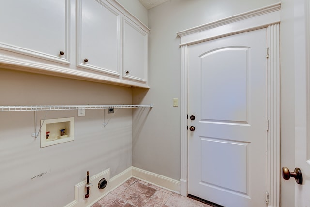 clothes washing area with cabinets, hookup for a washing machine, and electric dryer hookup