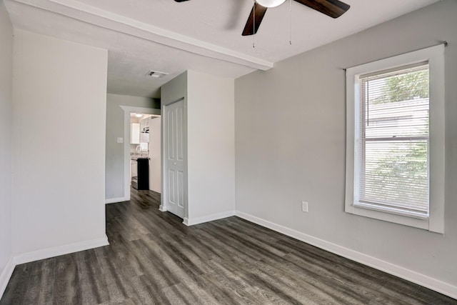 empty room with ceiling fan, dark hardwood / wood-style flooring, and sink