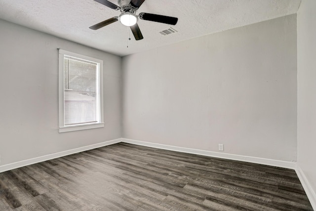 unfurnished room with dark hardwood / wood-style floors, ceiling fan, and a textured ceiling