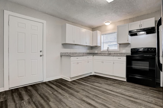 kitchen featuring light stone countertops, black electric range, white cabinets, and a textured ceiling