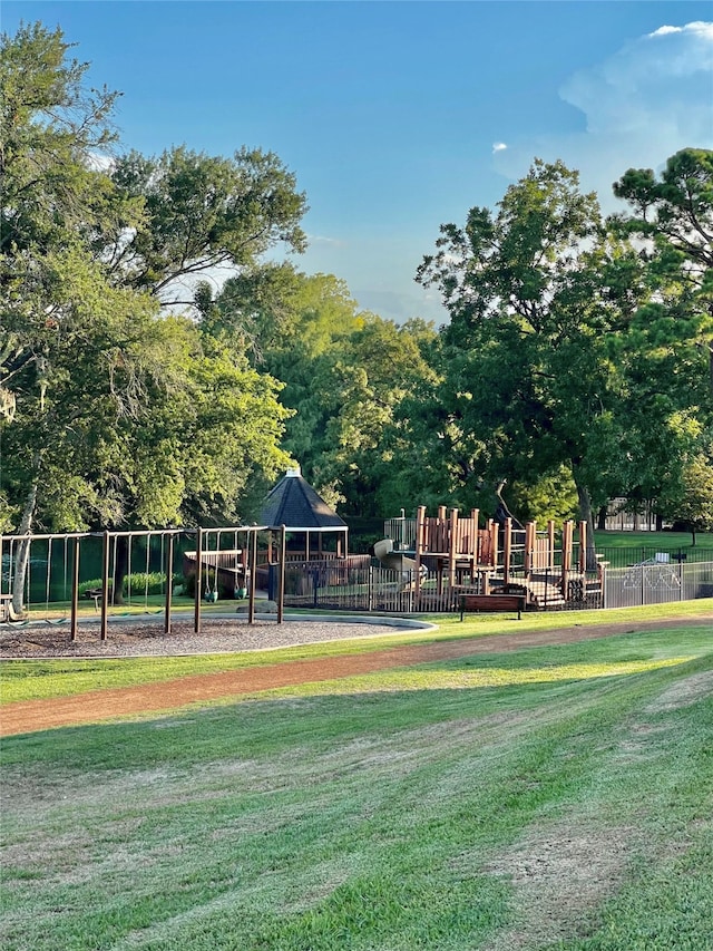 view of community with a playground and a yard