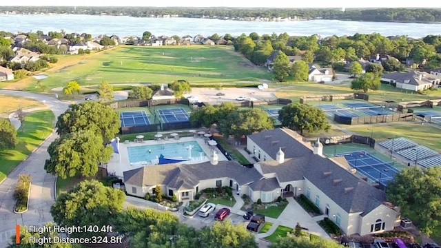 bird's eye view featuring a water view and a residential view