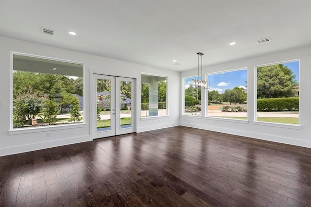 unfurnished sunroom featuring an inviting chandelier and visible vents