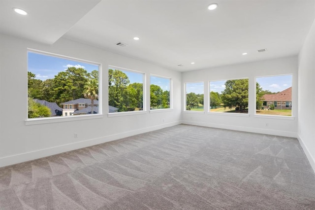 unfurnished sunroom featuring visible vents