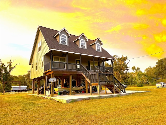 view of front facade with a yard and covered porch