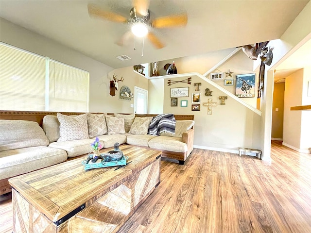 living room with ceiling fan and wood-type flooring