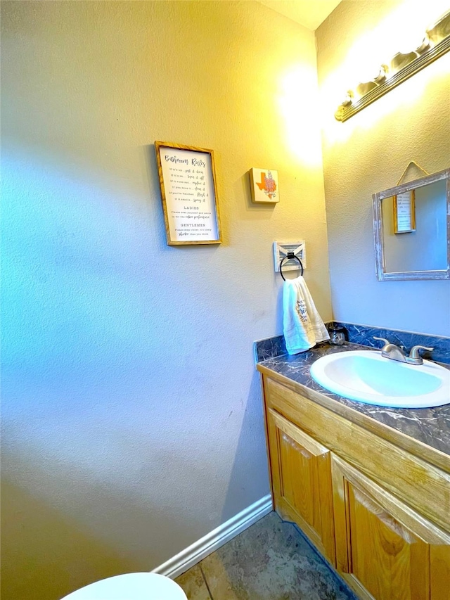 bathroom with tile patterned floors and vanity