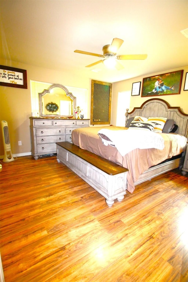 bedroom with light wood-type flooring and ceiling fan