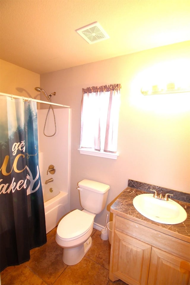 full bathroom featuring tile patterned flooring, vanity, toilet, and shower / bath combo with shower curtain