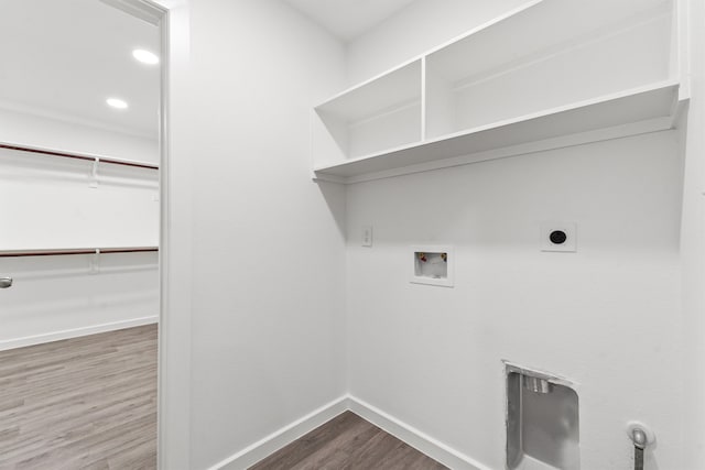 laundry area with washer hookup, hookup for an electric dryer, and hardwood / wood-style floors