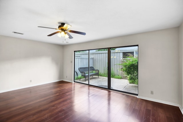 empty room featuring ceiling fan and dark hardwood / wood-style floors