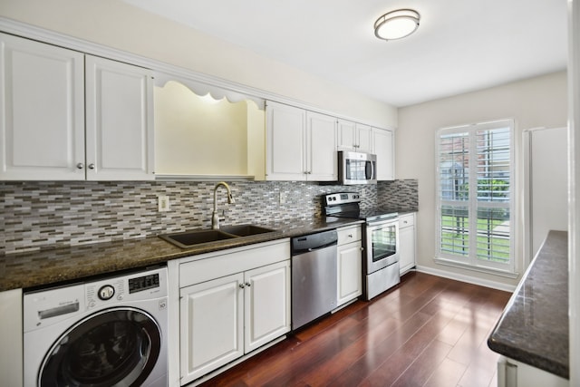 kitchen featuring sink, stainless steel appliances, washer / dryer, decorative backsplash, and white cabinets