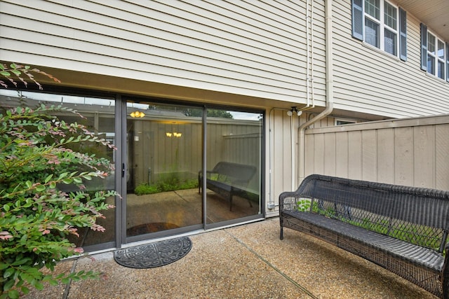 entrance to property featuring a patio area