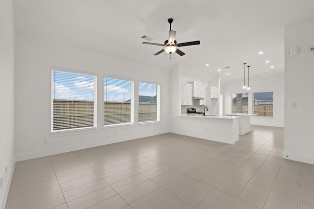 unfurnished living room featuring light tile patterned floors and a healthy amount of sunlight