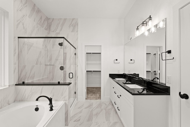 bathroom featuring vanity and shower with separate bathtub