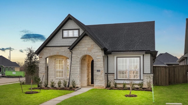 view of front of home with a lawn