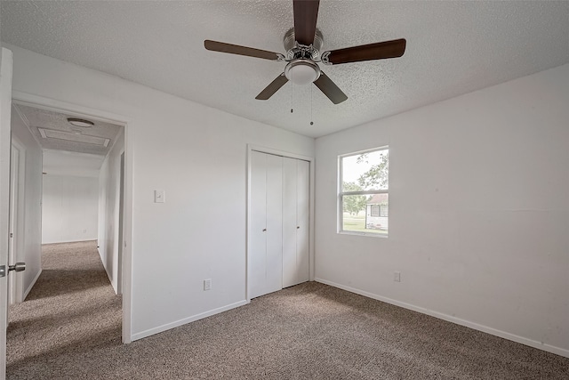 unfurnished bedroom featuring a closet, ceiling fan, and dark carpet