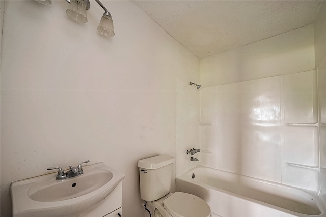 full bathroom with vanity, toilet, a textured ceiling, and shower / bathtub combination