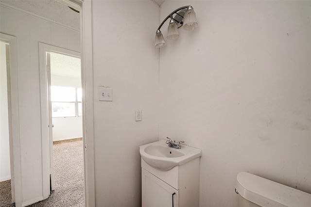 bathroom with toilet and vanity