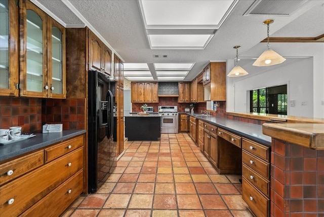 kitchen with decorative backsplash, dark countertops, glass insert cabinets, black appliances, and a sink