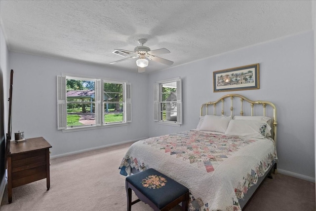 carpeted bedroom featuring visible vents, a textured ceiling, and baseboards