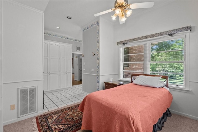 bedroom with crown molding, visible vents, a ceiling fan, light carpet, and baseboards