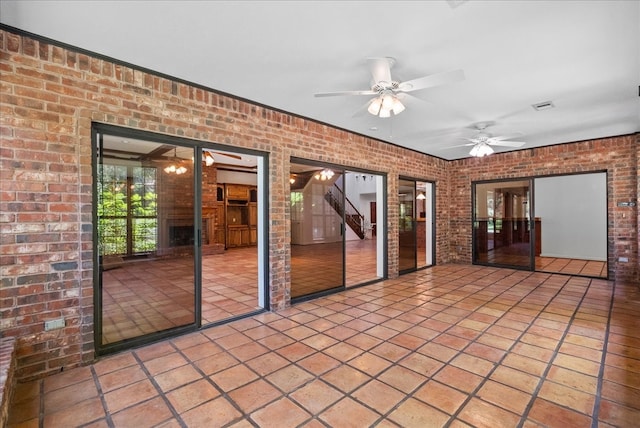 interior space featuring ceiling fan and visible vents