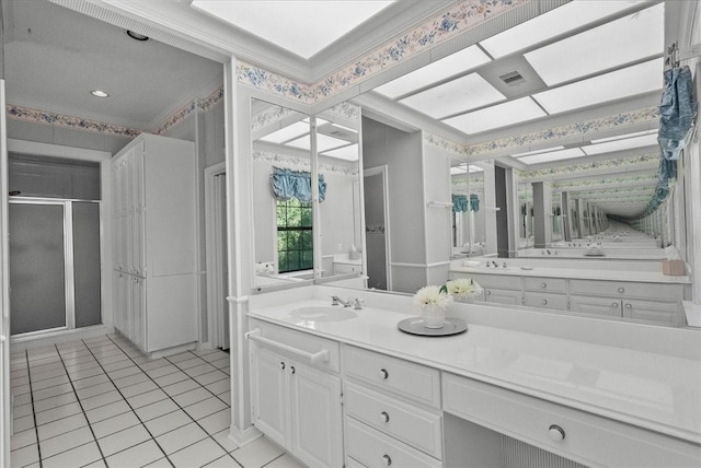 bathroom featuring a shower stall, vanity, visible vents, and tile patterned floors