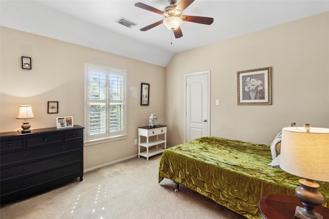 carpeted bedroom with ceiling fan and lofted ceiling