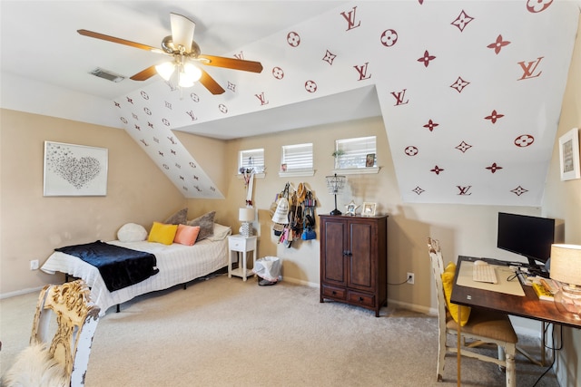 carpeted bedroom with vaulted ceiling and ceiling fan