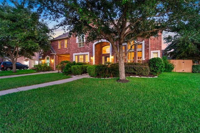 view of front of house with a yard