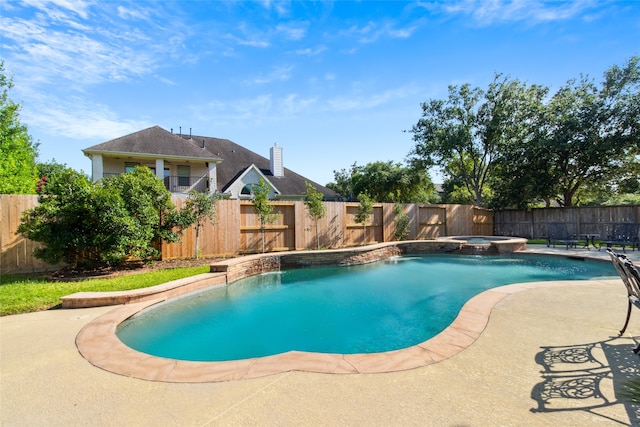 view of swimming pool featuring an in ground hot tub, a patio, and pool water feature