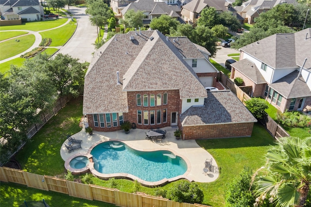 view of swimming pool with a patio area and a yard