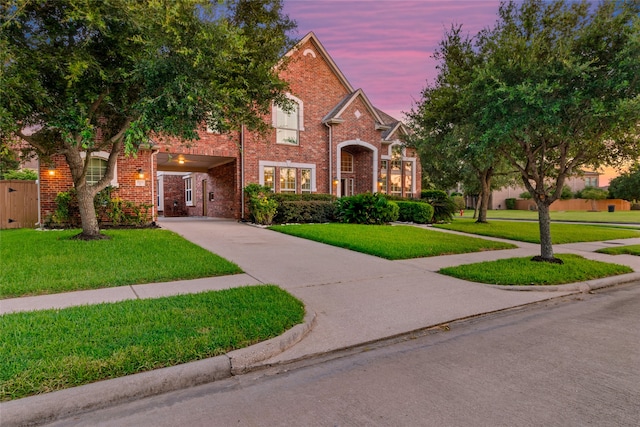 view of front of property with a lawn