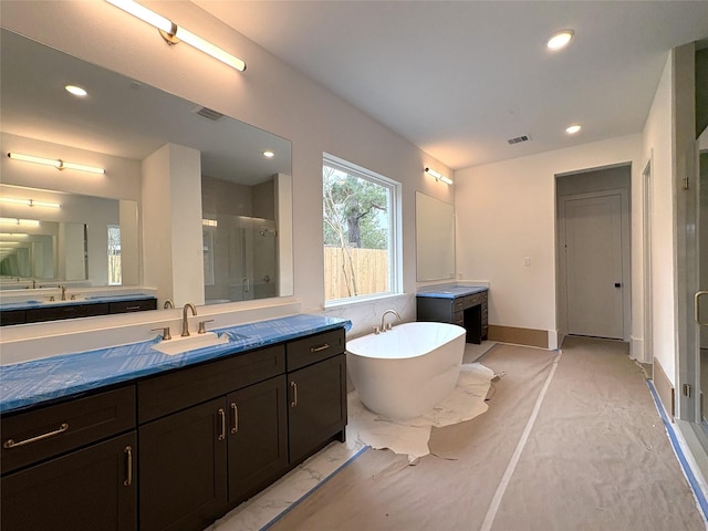 bathroom featuring independent shower and bath and vanity