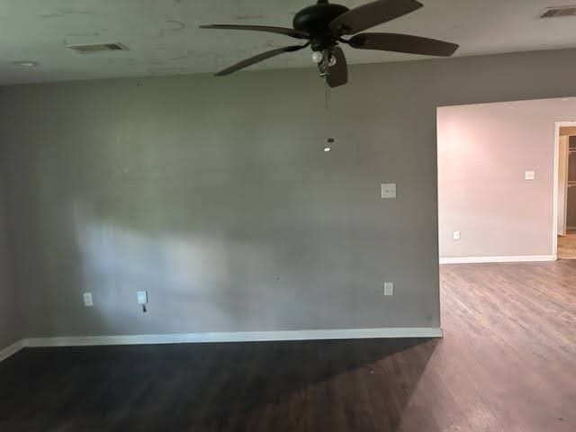 spare room with ceiling fan and hardwood / wood-style floors