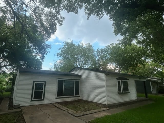 back of property featuring a patio area