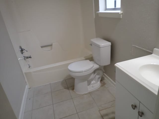 full bathroom featuring tile floors, bathtub / shower combination, vanity, and toilet