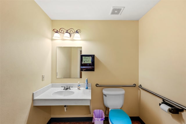 bathroom featuring sink and toilet