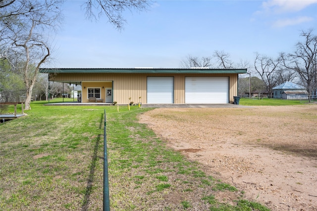 garage featuring a yard