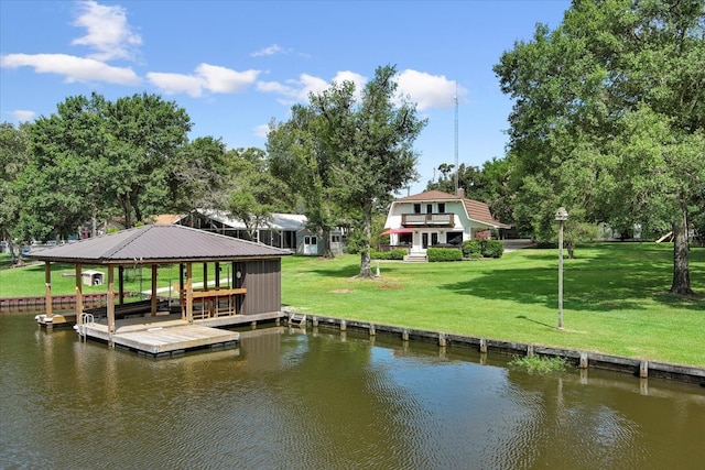 view of dock with a water view, a gazebo, and a lawn