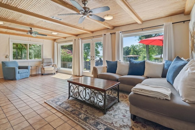 living room with french doors, beamed ceiling, ceiling fan, and tile floors